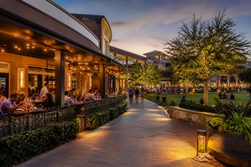 Evening dining and green space in Katy